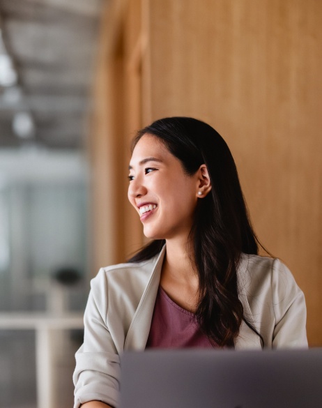 Professional businesswoman in an office using her laptop.