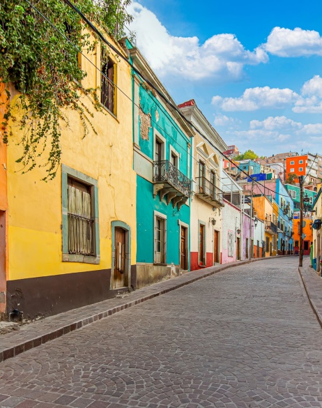 Colorful buildings on a street in Mexico.
