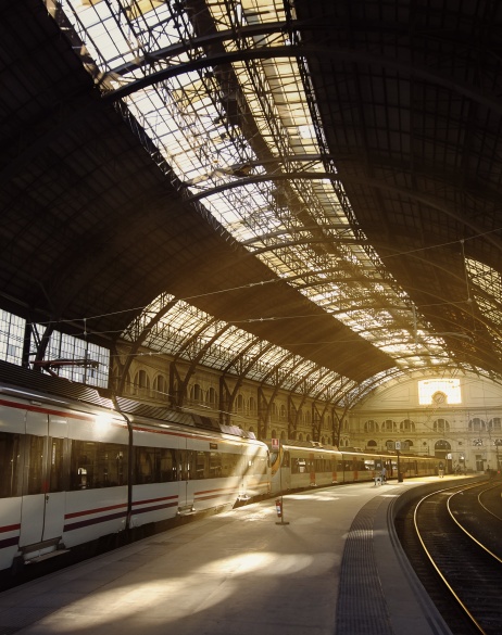 Train arriving in a covered station.