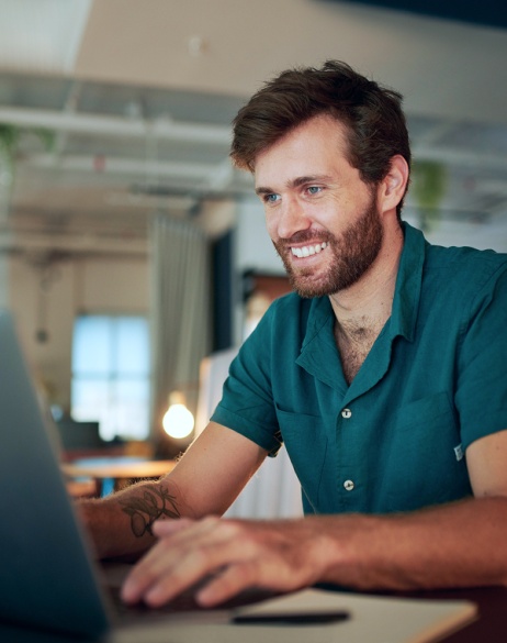 Smiling employee hired by a company using Pebl to hire top AI talent globally