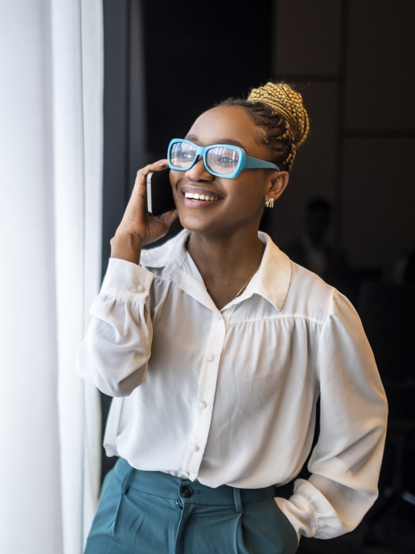 Woman in professional setting on phone discussing EOR options