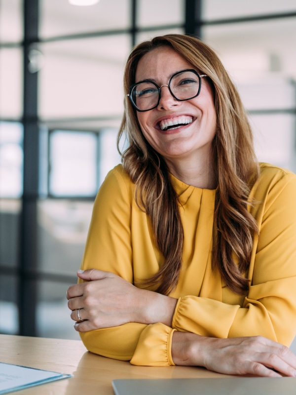 Woman learning the options of Pebl equity management services in a business setting.