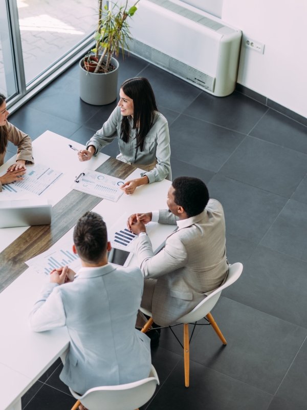 Team meeting among four colleagues discussing global expansion.