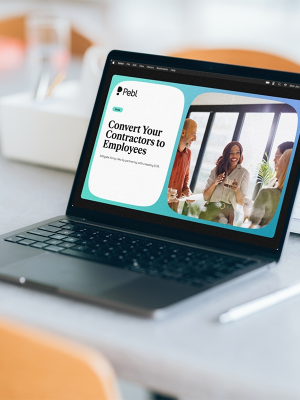 Laptop on desk displaying Convert Your Contractors to Employees guide.