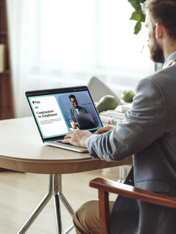 An HR professional reading the Contractors vs. Employees guide.