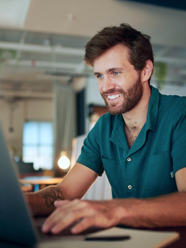 Smiling employee hired by a company using Pebl to hire top AI talent globally