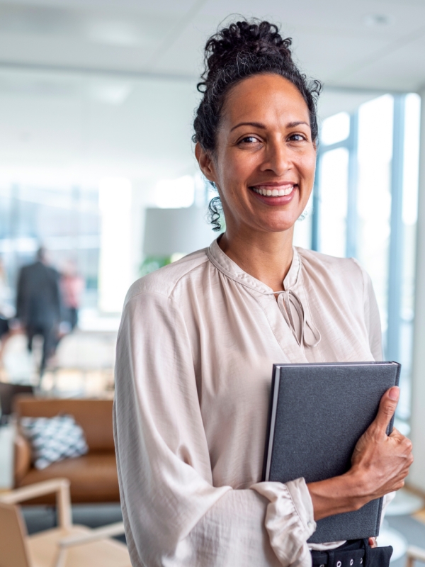 How to Hire Faster Using Our Enhanced Onboarding Process A new employee is being onboarded in a friendly office space
