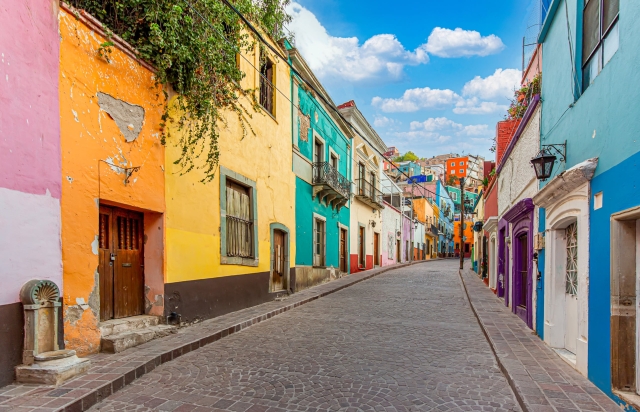 Colorful buildings on a street in Mexico.