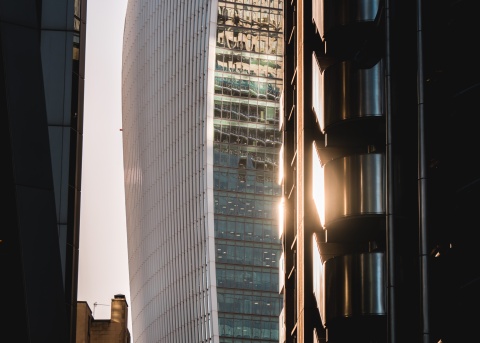 Sunset reflecting off a skyrise building in a city downtown