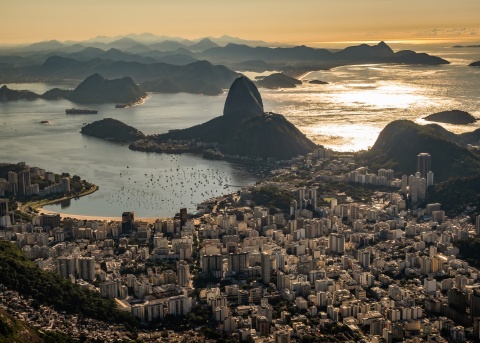 Aerial view of Rio de Janeiro, Brazil’s downtown and beach at dusk.