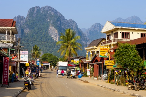 Street view of distant mountains in Vang Vieng Laos