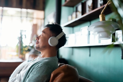 Man listening to music on headphones at the office