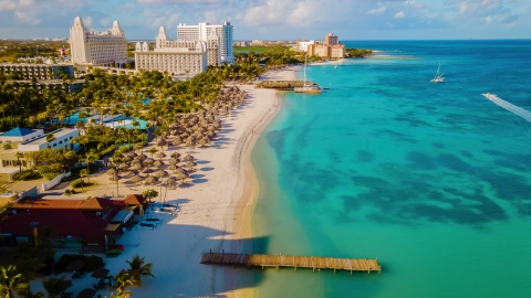 Aerial perspective of a white sand beach and resorts in Aruba