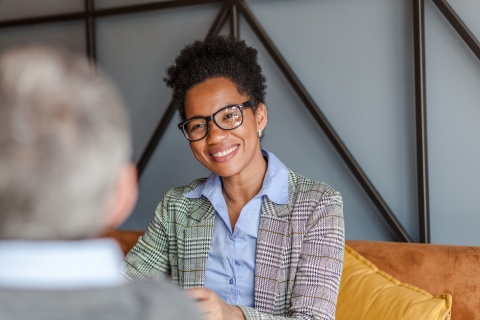 Businesswoman in Comoros talking to her colleague in the office
