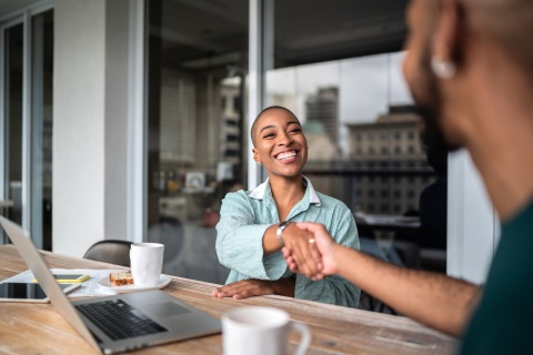Woman shaking hands after discussing salary in Azerbaijan