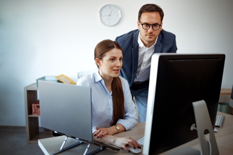 Global HR managers researching payroll tax in Benin together