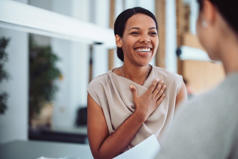 Woman smiling during a conversation about salary in the Dominican Republic