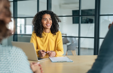 Businesswoman having a conversation about salary in Latvia