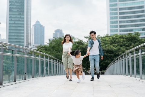 Chinese family walking and exploring a city during a Chinese public holiday