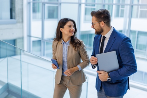 Business colleagues collaborating and discussing payroll tax in Cyprus