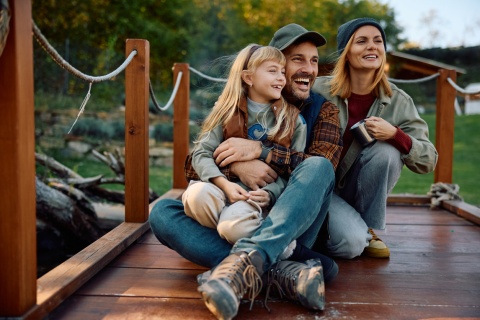 Smiling family on a dock enjoying Belarus’s public holidays