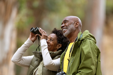 Couple bird watching and hiking during Benin’s public holidays