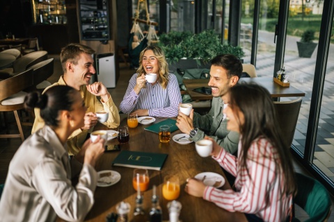 Friends having coffee together on a terrace during Turkmenistan’s public holidays