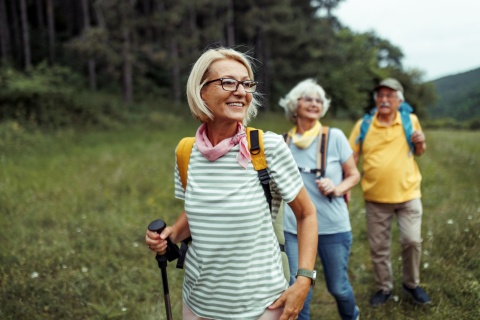 Friends smiling on a hike during Tajikistan's public holidays