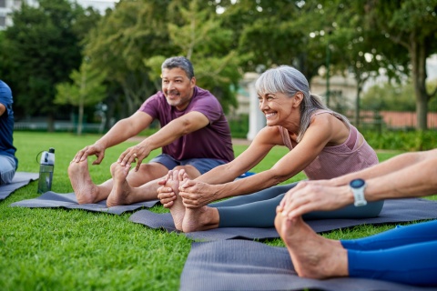 People doing yoga in a park during Tunisia's public holidays