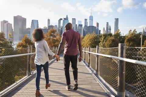 Couple walking across a bridge enjoying Bolivia’s public holidays