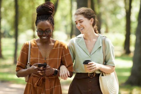 Friends walking in a wooded park enjoying Algeria’s public holidays