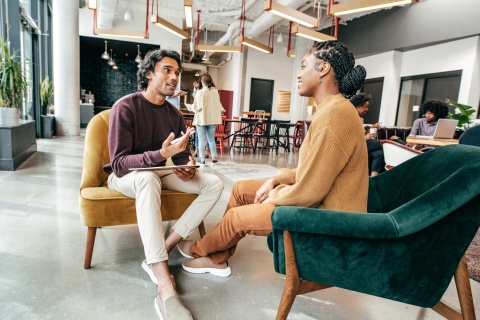 Men and woman talking about business in casual office