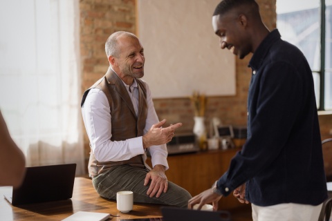 Manager discussing bereavement leave with an employee in a supportive office conversation.